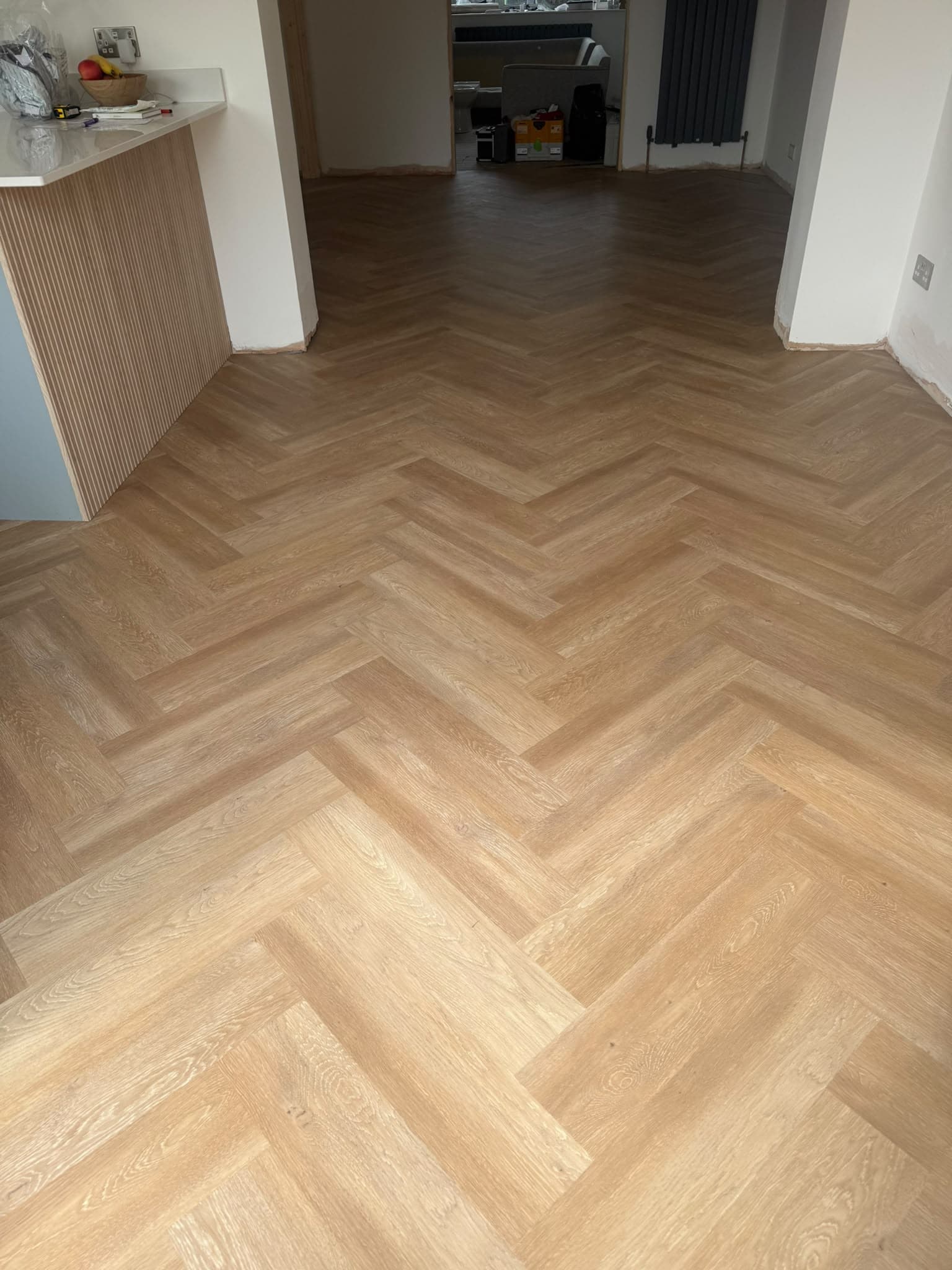 Bespoke fluted oak kitchen island and herringbone flooring