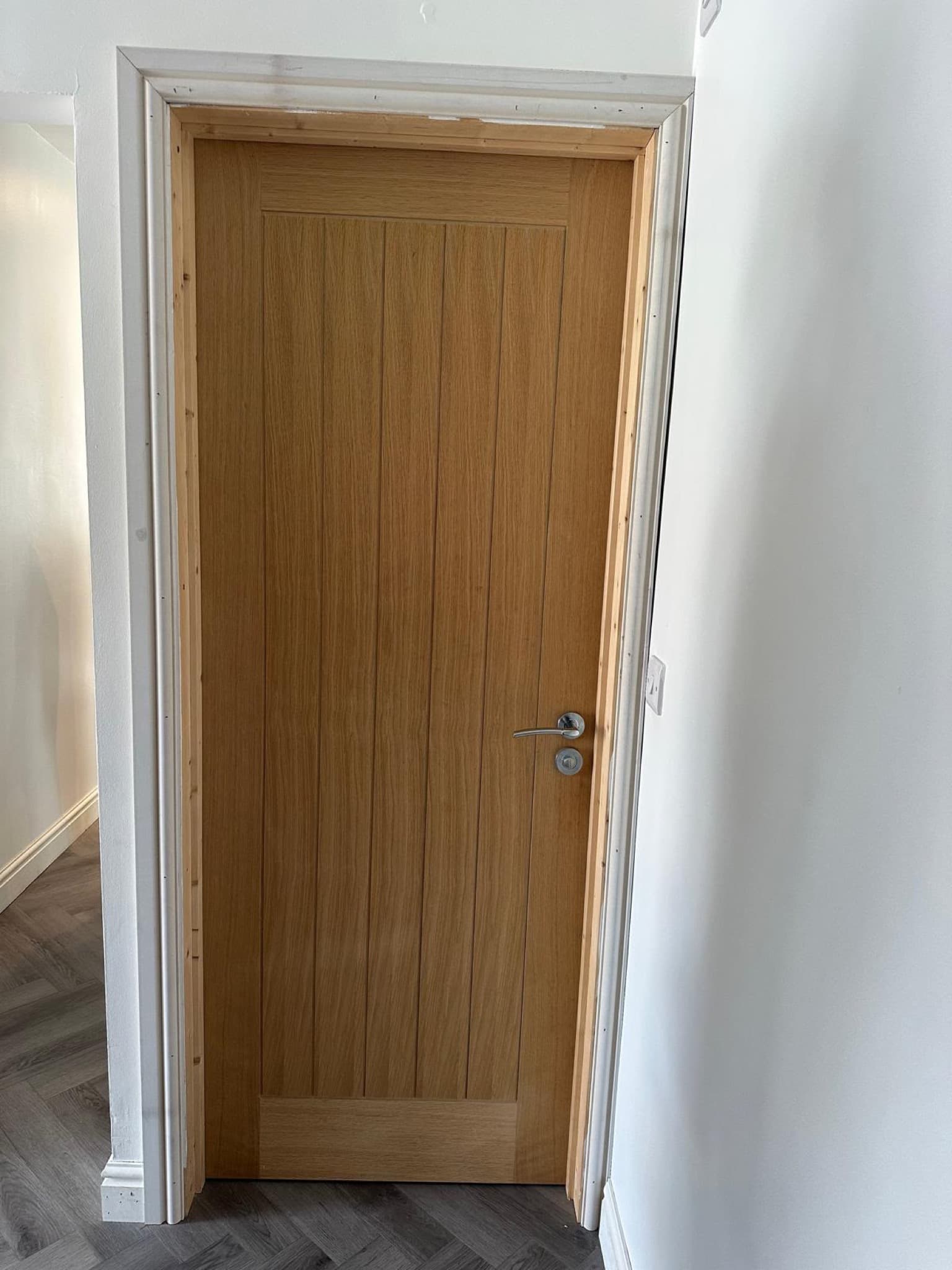 Detail of an oak door and ironmongery